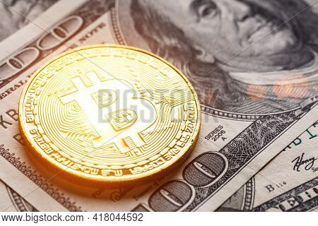 Golden Bitcoin Lies On The Banknotes.new Virtual Money. Crypto Currency Top View. Real Coins Of Bitc