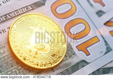 Golden Bitcoin Lies On The Banknotes.new Virtual Money. Crypto Currency Top View. Real Coins Of Bitc