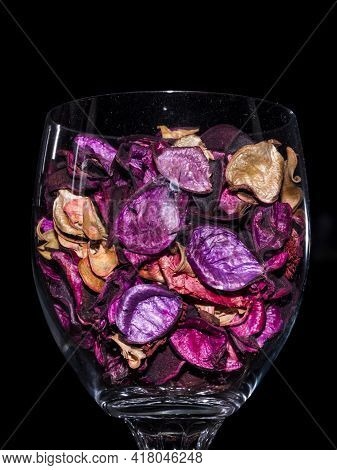 Colored Dried Flower Petals In A Glass