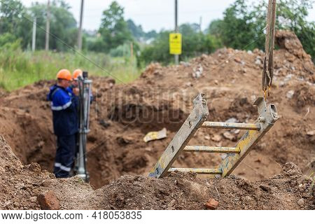 A Man Working In Uniform Is Engaged In Repairing The Gas Pipe, Repairing The Equipment With Tools, I