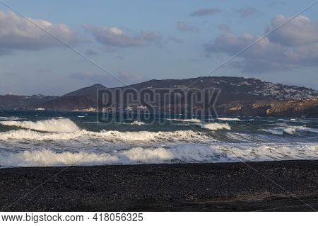 Beautiful Black Beach With Coast And Sea In Vlichada With Blue Sky Background With White Clouds And 