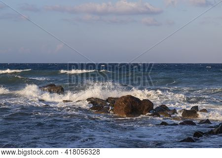 Beautiful Black Beach With Coast And Sea In Vlichada With Blue Sky Background With White Clouds And 