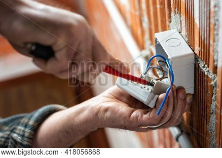 Electrician At Work On A Residential Electrical System. Electricity.