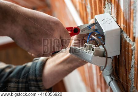 Electrician At Work On A Residential Electrical System. Electricity.
