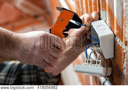 Electrician At Work On A Residential Electrical System. Electricity.