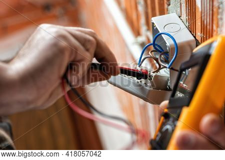 Electrician At Work On A Residential Electrical System. Electricity.
