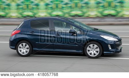 Moscow , Russia - April 2021: Hatchback Peugeot 308 Moves At High Speed In The City Street. Peugeot 