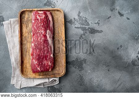 Gourmet Portion Of Raw Fresh Marbled Beef Fillet Set, On Gray Stone Background, Top View Flat Lay, W