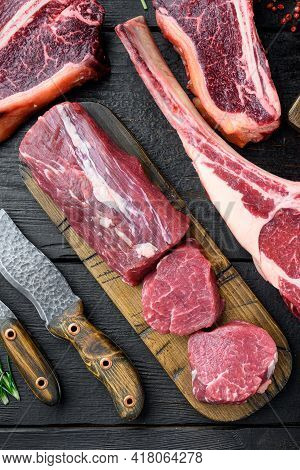 Fresh Raw Beef Steak Mignon Whole Cut Set, On Black Wooden Table Background, Top View Flat Lay