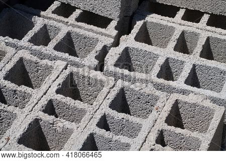 Stacked Hollow Concrete Blocks, Harsh Shadows, Background