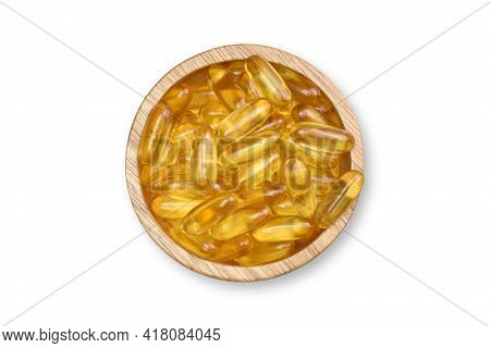 Clipping Path. Top View(flat Lay) Of Supplementary Food. Gold Salmon Fish Oil Capsules On Wood Bowl 