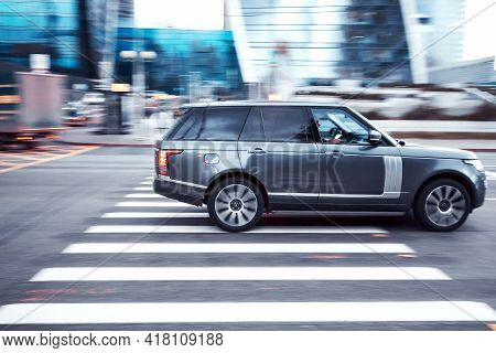 Moscow, Russia - April 2021: Fast Moving Suv Rides On A City Road. Premium Car On The Road In Motion