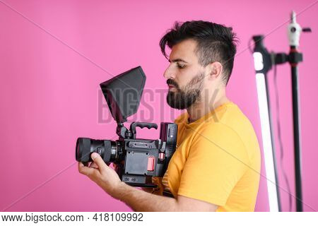 cameraman with professional equipment shoots video clips