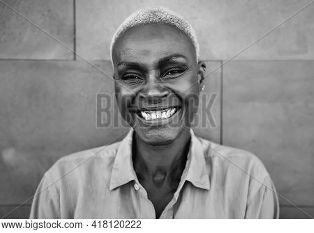 Happy Afro Woman Portrait - African Senior Female Having Fun Smiling In Front Of Camera - Black And 