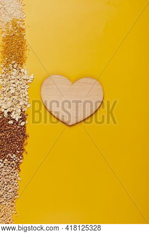 Flat Lay Of Set Of Heap Various Grains And Cereals On Yellow Background