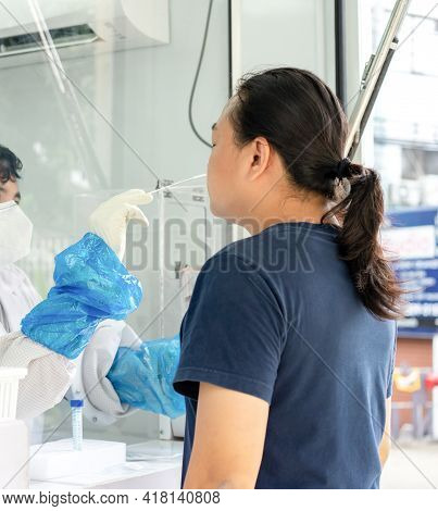 Asian Man Was Tested By Medical Staff In Negative Room Pressure For Covid-19 Test At Outdoor Field.