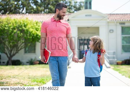 Father And Son Go To School, Education And Learning. School, Family, Education And Outdoor Concept.