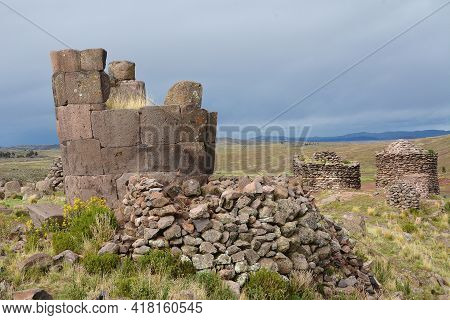Sillustani Tombs In The Peruvian Andes At Puno Peru.\nan Inca Burial Tower At The Sillustani Archaeo