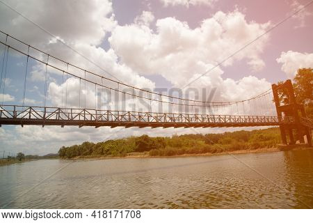 Wooden Suspension Bridge That Crosses A Reservoir In A Public Park In Thailand. (1 Of 8)