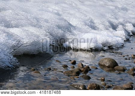 Ice On The River, Stream Froze. Cold Season. Mountain Stream Stones. Thaw Spring Snow.  Ice Started 