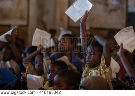 Mzuzu, Malawi. 30-05-2018. Afro-descendent Children Attending School Proudly Showing Their Teacher T