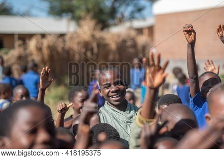 Mzuzu, Malawi. 30-05-2018. Portrait Of A Smiling Black Boy After Finishing The School Day Before Goi