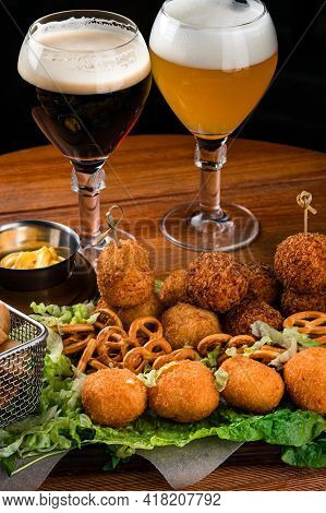 Brazilian Appetizer Deep Fried Cheese Croquette With Two Glasses Of Beer