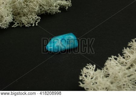 Howlite Or Turquoise Imitation From Republic Of South Africa Rsa. Natural Mineral Stone On A Black B
