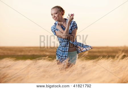 Young Woman With A Bottle Of Perfume