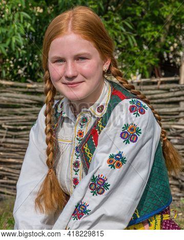 Salaj, Transylvania, Romania-may 14, 2018: Beautiful  Young Girl With Red Hair And Blue Eyes In Trad