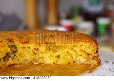 Slice Of Homemede Pie With Apples And Nuts. Close Up. Beautiful Amber Light.