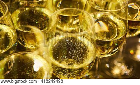 Glasses Of White Wine Are On The Table, Ready To Serve