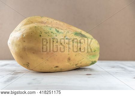 Formosa Variety Papaya Fruit On Wooden Background