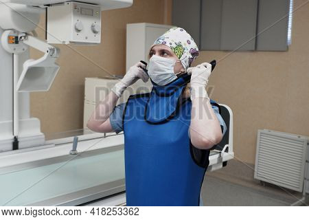 The Work Of A Radiologist In The X-ray Room For Diagnostics.