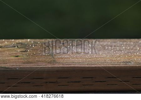 Old Wood Deck Railing Covered In Tiny Dew Drops