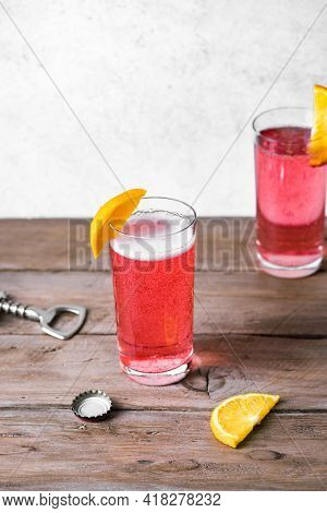 Grapefruit Or Cherry Radler, Citrus Beer Cocktail. Refreshing Fruit Beer Drink In Glasses.
