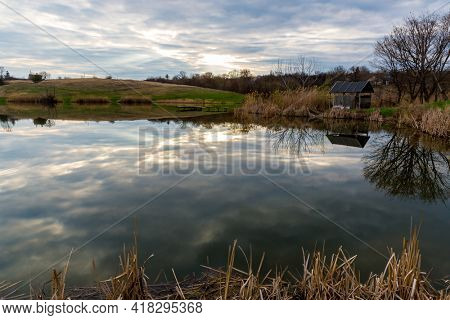 quier evening scene on rural lake at spring time