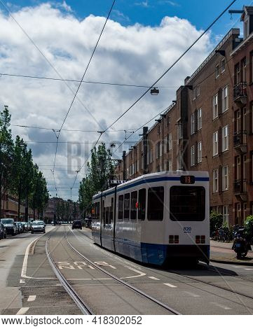 Amsterdam, The Netherlands July 1 2020: Tram Line 13 Traveling Down The Street
