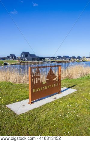Blauwestad, Netherlands - April 24, 2021: Rusty Entrance Sign Of The Harbor District In Blauwestad, 