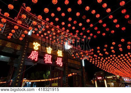 Puli Township, Taiwan -December 01, 2020: Puli Heng Ji Gong Matsu Temple with red lanterns in the night at Chinese altar, Taoist special dedication sacrificial ceremony , Nantou, Taiwan