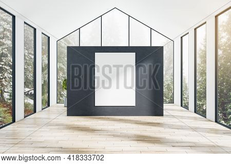 Blank White Poster On Black Partition In The Center Of Modern Sunny Houseroom With Forest View From 