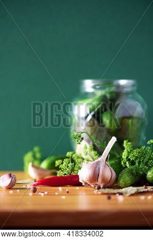 Pickling Cucumbers In Cans. Ingredients For Marinated Gherkins, Glass Jar, Garlic, Dill, Salt, Peppe