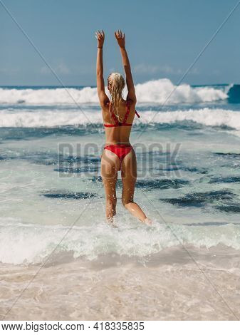 Attractive Woman In Swimwear Enjoyning Summer At Ocean Beach