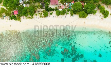 Aerial Drone Of Sandy Beach And Azure Water Surrounded By A Coral Reef And An Atoll. Alorro Beach, P
