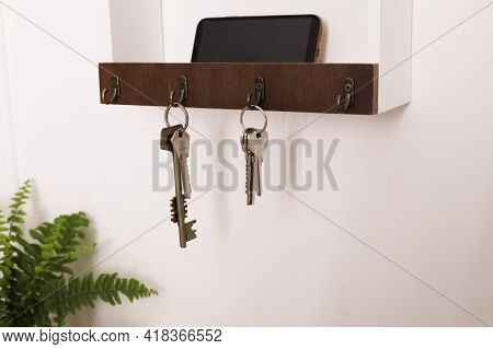Wooden Hanger For Keys On White Wall