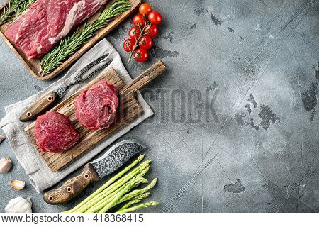 Beef Fillet Mignon Cut Raw Set, On Gray Stone Background, Top View Flat Lay, With Copy Space For Tex