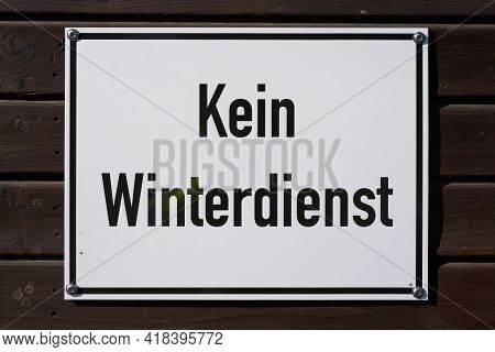 Sign On A Path In Germany With The Inscription No Winter Service (kein Winterdienst)