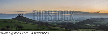 Beautiful Vibrant Sunrise Panoramic Landscape Image Of Colmer's Hill In Dorset On A Spring Morning