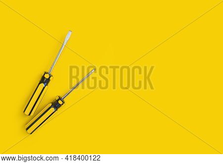 Screwdriver On A Colored Background Construction Steel