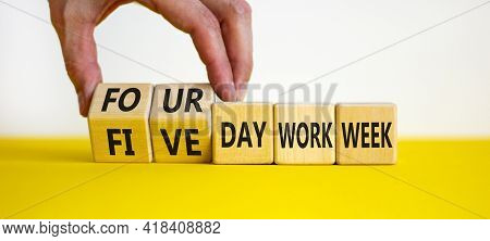 4 Or 5 Day Work Week Symbol. Businessman Turns Cubes, Changes Words 'five Day Work Week' To 'four Da